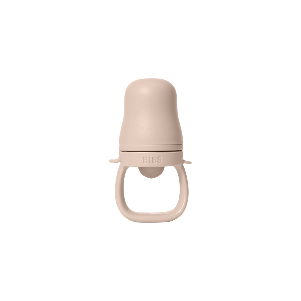 bibs blulsh baby feeder with a cap on